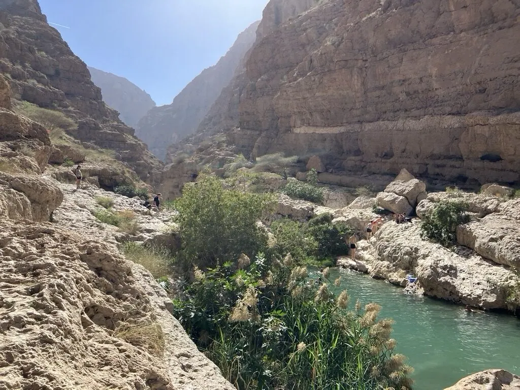 Rocky landscape and clear water at Wadi Shab in Oman